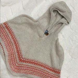 Knitted cape with hood